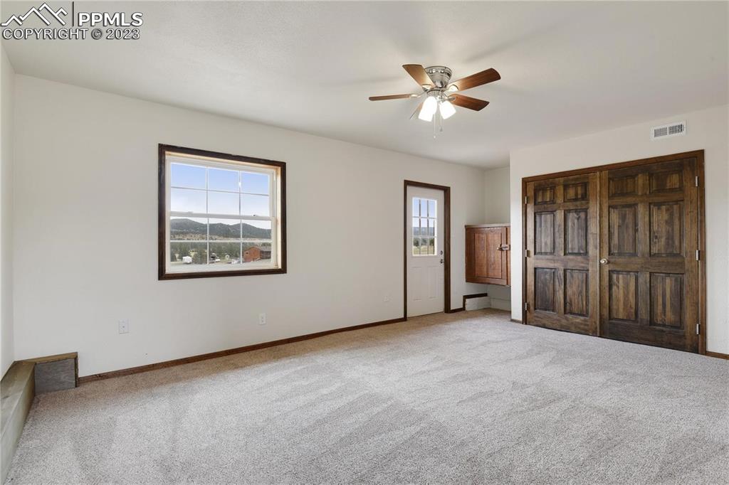 13771 South Hedi Road Sedalia, CO 80135 - Photo 26 of 49 a view of an empty room with a ceiling fan