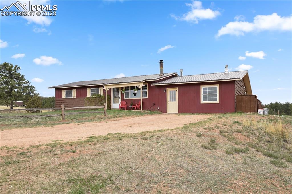 13771 South Hedi Road Sedalia, CO 80135 - Photo 31 of 49 a view of a yard in front of a house with a yard