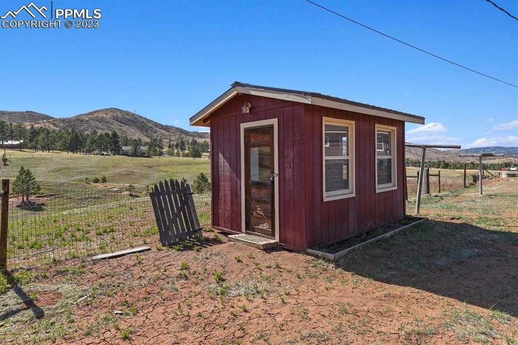 13771 South Hedi Road Sedalia, CO 80135 - Photo 40 of 49 a view of a house with a yard