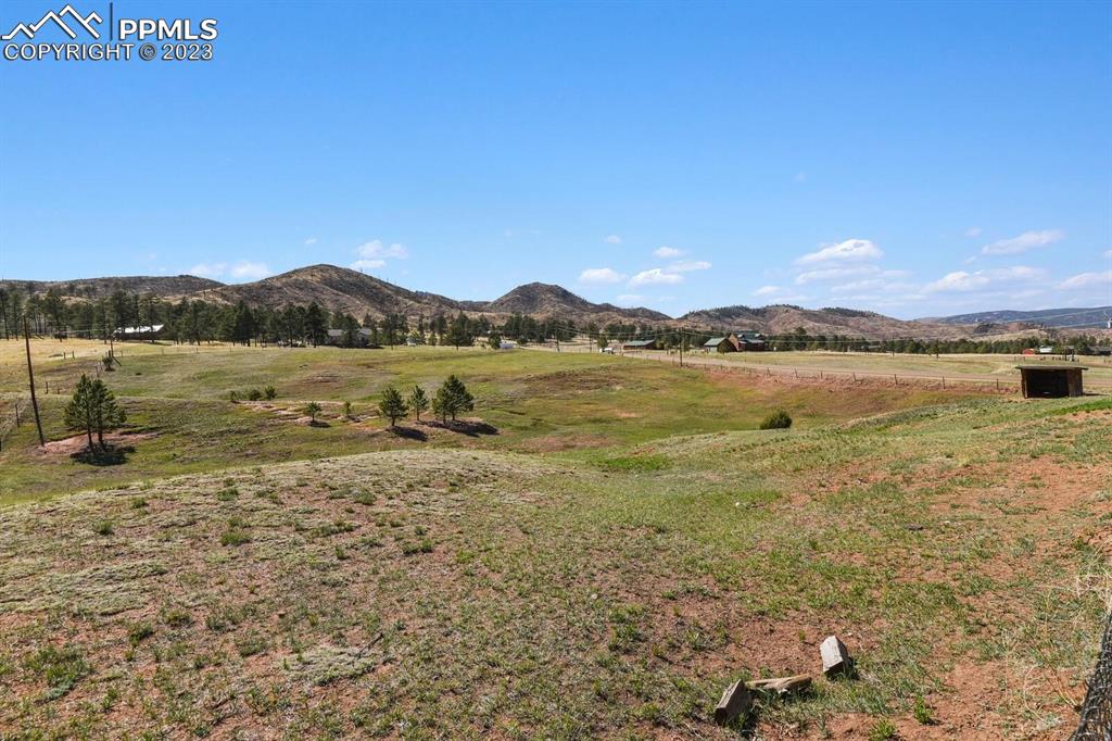 13771 South Hedi Road Sedalia, CO 80135 - Photo 42 of 49 a view of an ocean with a mountain
