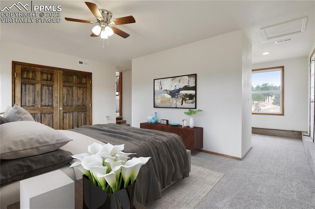 13771 South Hedi Road Sedalia, CO 80135 - Photo 10 of 49 a bedroom with a bed and ceiling fan