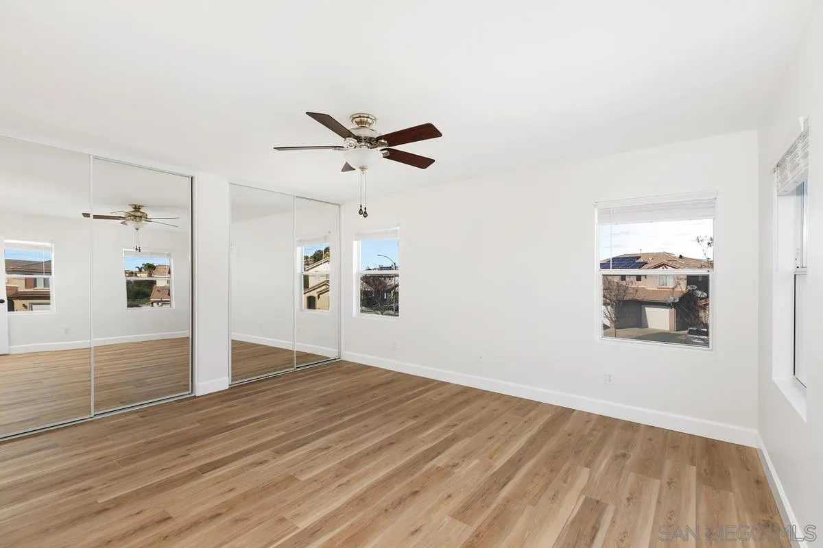 1651 Applegate Street Chula Vista, CA 91913 - Photo 12 of 20 an empty room with wooden floor and windows
