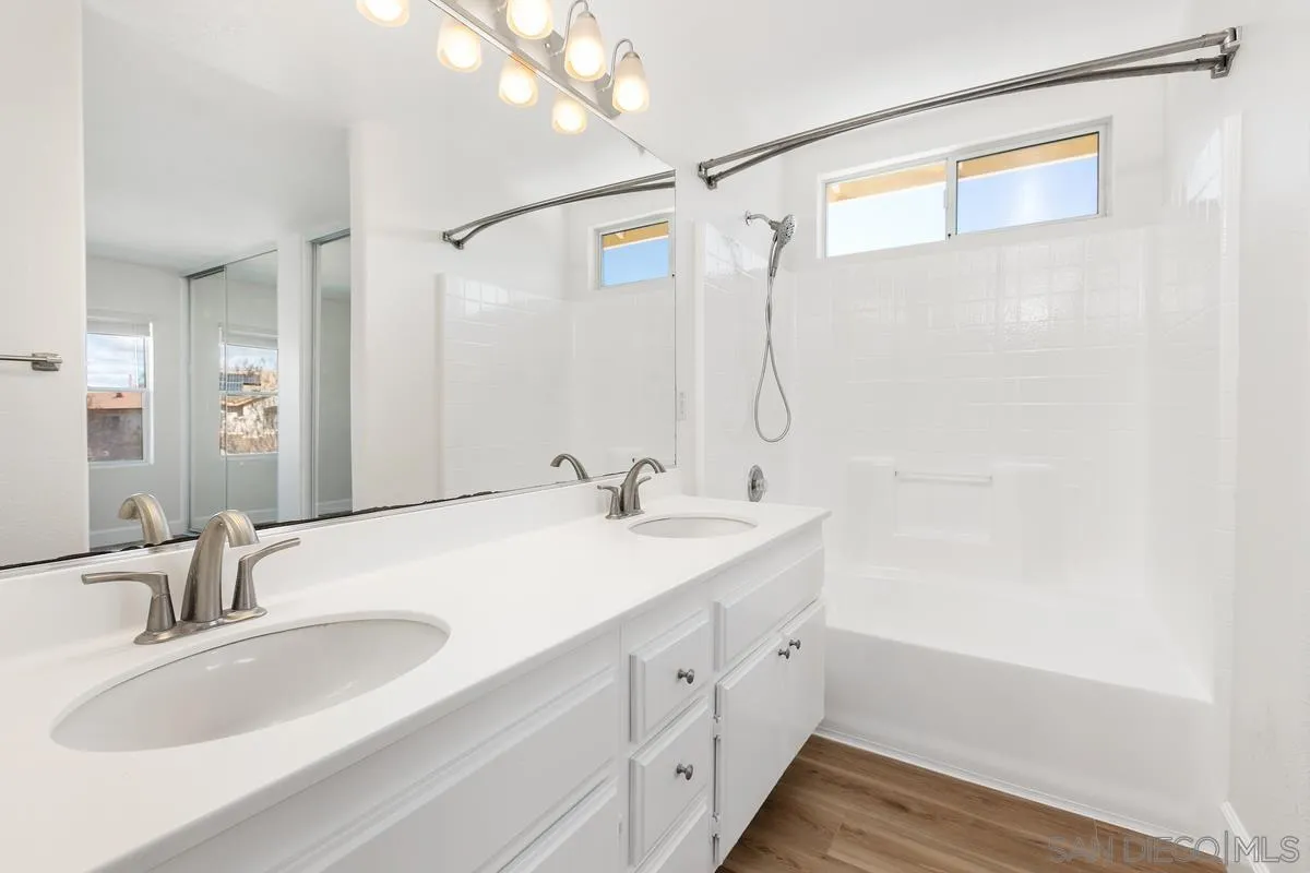 1651 Applegate Street Chula Vista, CA 91913 - Photo 14 of 20 a bathroom with a tub sink and mirror