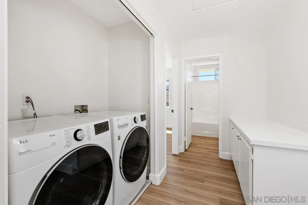 1651 Applegate Street Chula Vista, CA 91913 - Photo 16 of 20 a view of a hallway with washer and dryer