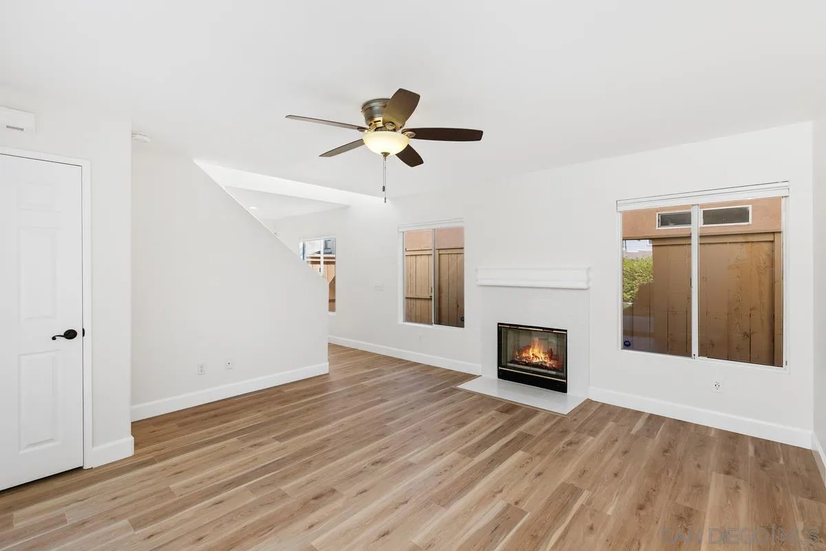 1651 Applegate Street Chula Vista, CA 91913 - Photo 4 of 20 a view of a livingroom with wooden floor and a ceiling fan