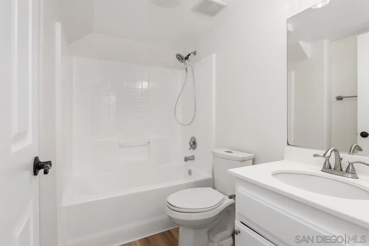 1651 Applegate Street Chula Vista, CA 91913 - Photo 8 of 20 a bathroom with a granite countertop sink toilet and shower