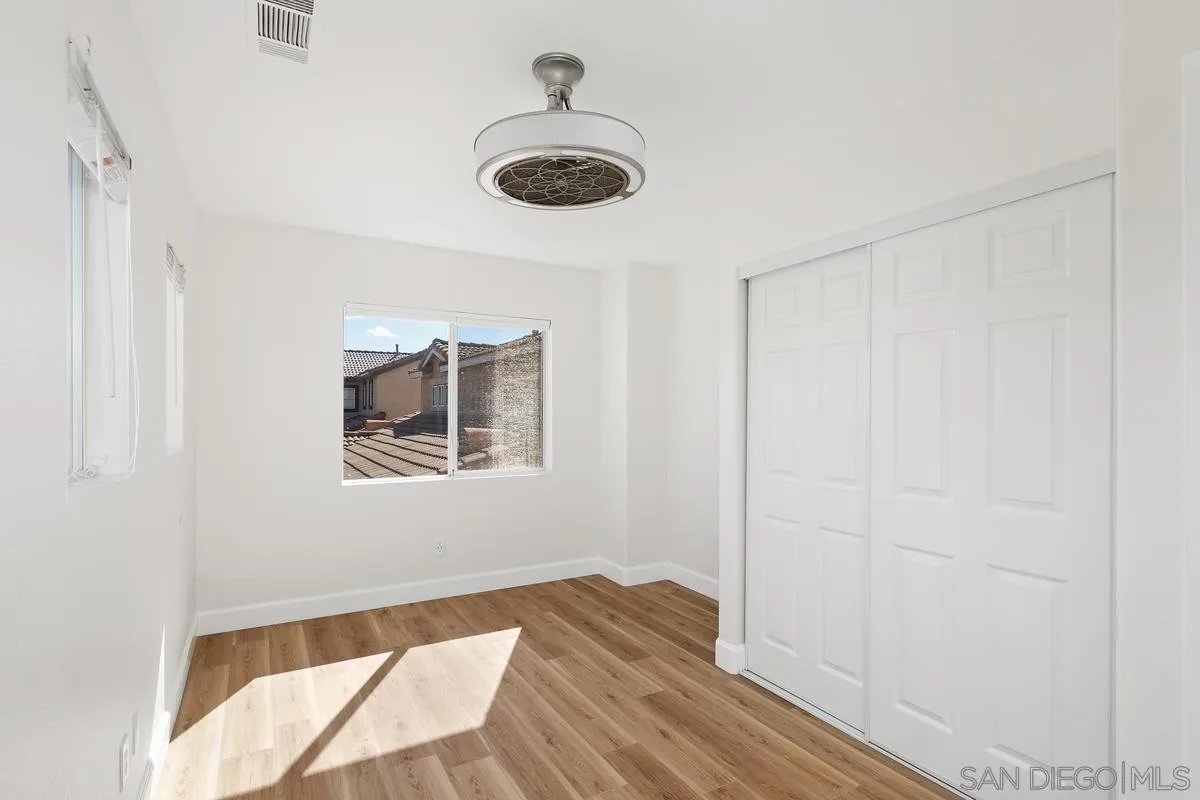 1651 Applegate Street Chula Vista, CA 91913 - Photo 9 of 20 a view of a livingroom with wooden floor and a window