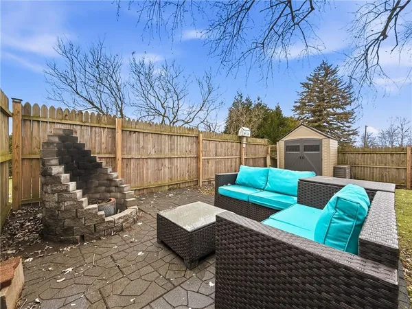 a view of a deck with couches and potted plants