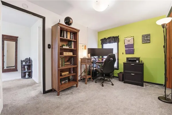 a view of a workspace with furniture and toys
