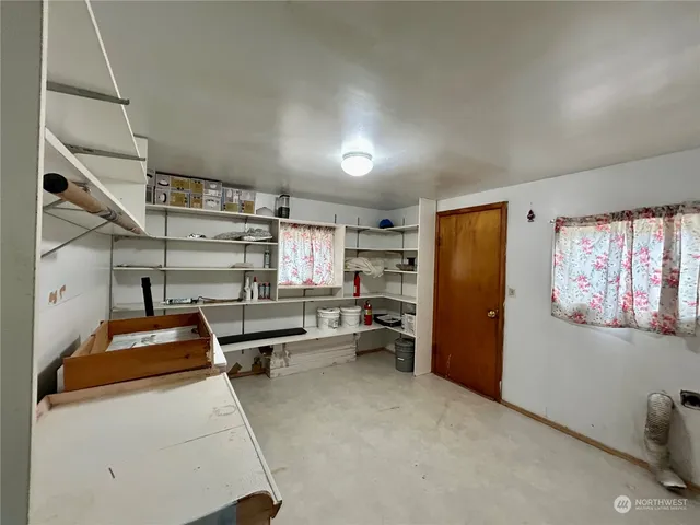 a kitchen with cabinets and window