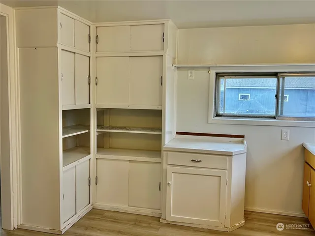 a view of an empty room with closet