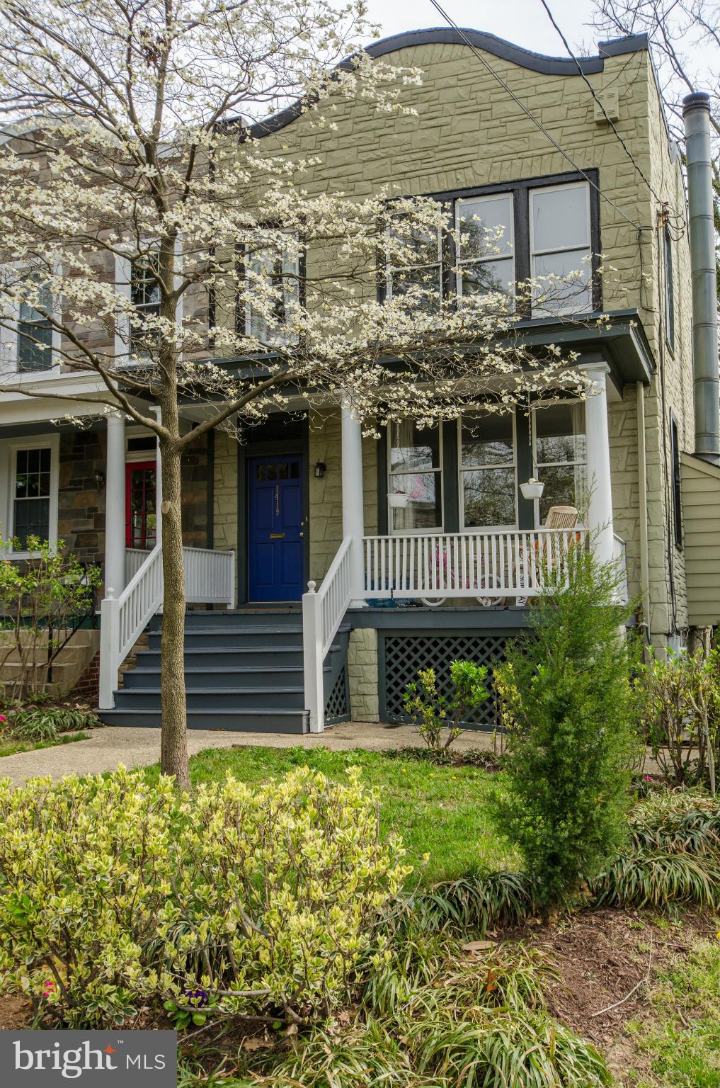 1419 Foxhall Road Northwest Washington, DC 20007 - Photo 1 of 19 a front view of a house with a garden