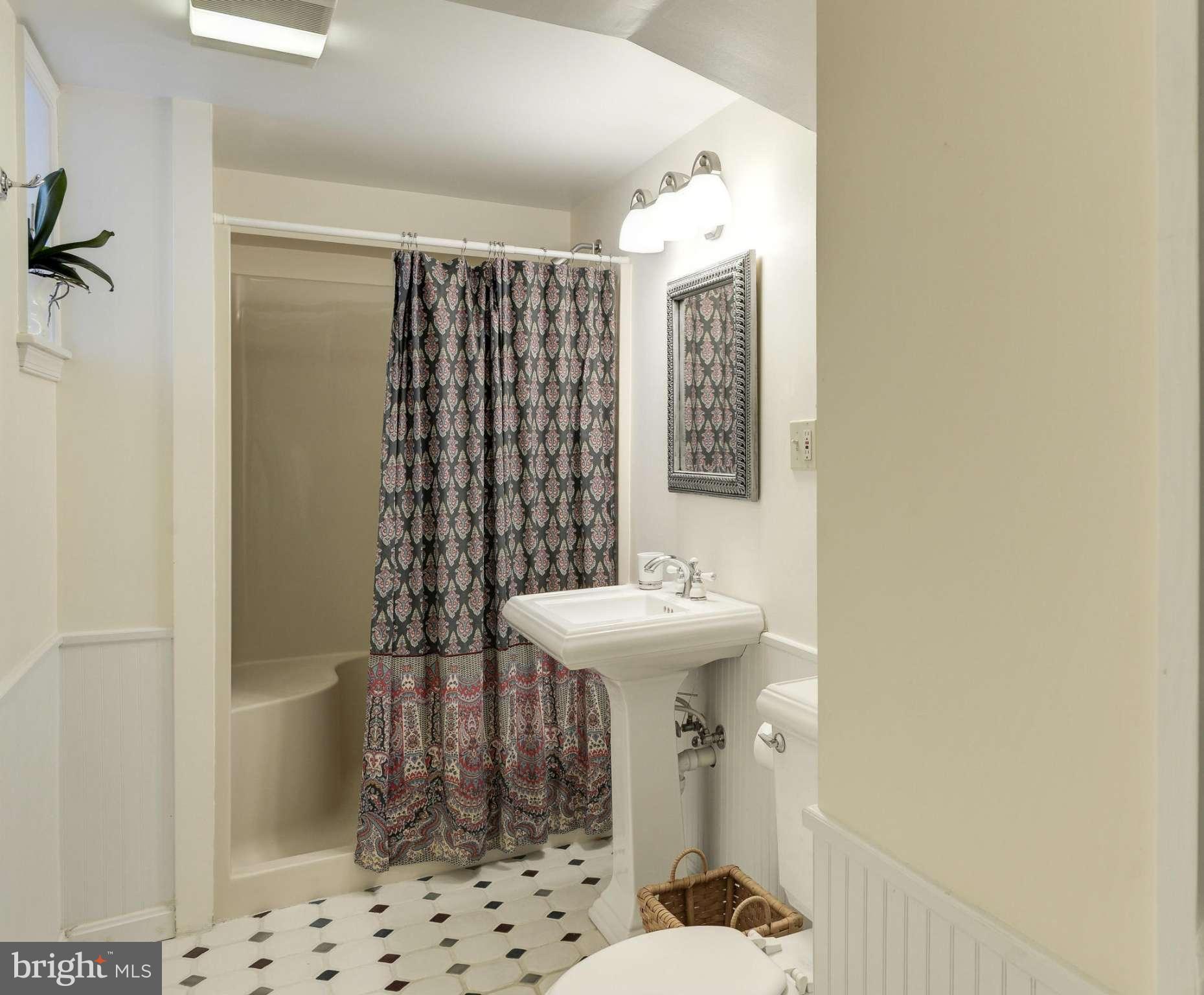 1419 Foxhall Road Northwest Washington, DC 20007 - Photo 16 of 19 a bathroom with a sink toilet and shower