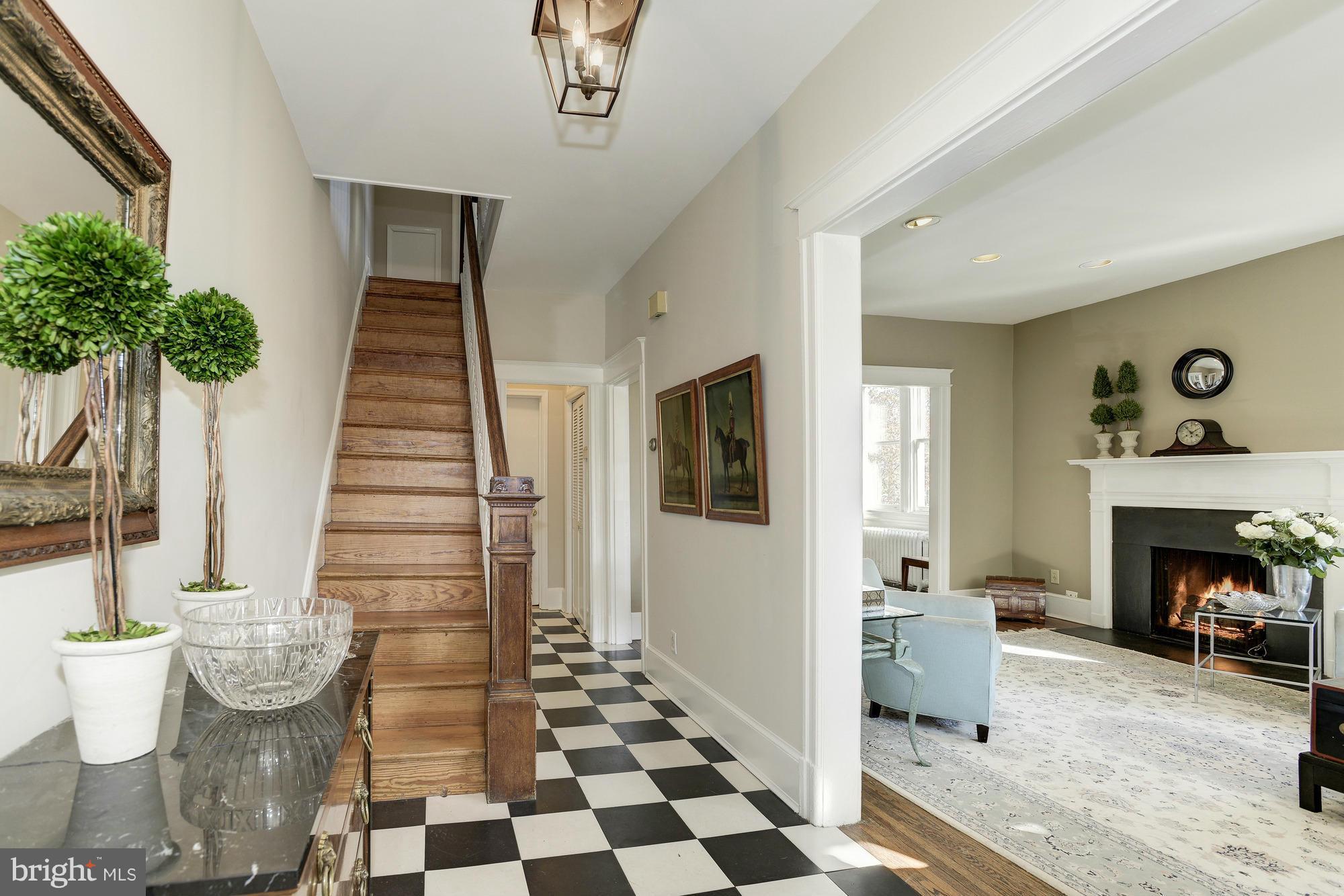 1419 Foxhall Road Northwest Washington, DC 20007 - Photo 3 of 19 a living room with furniture and a fireplace