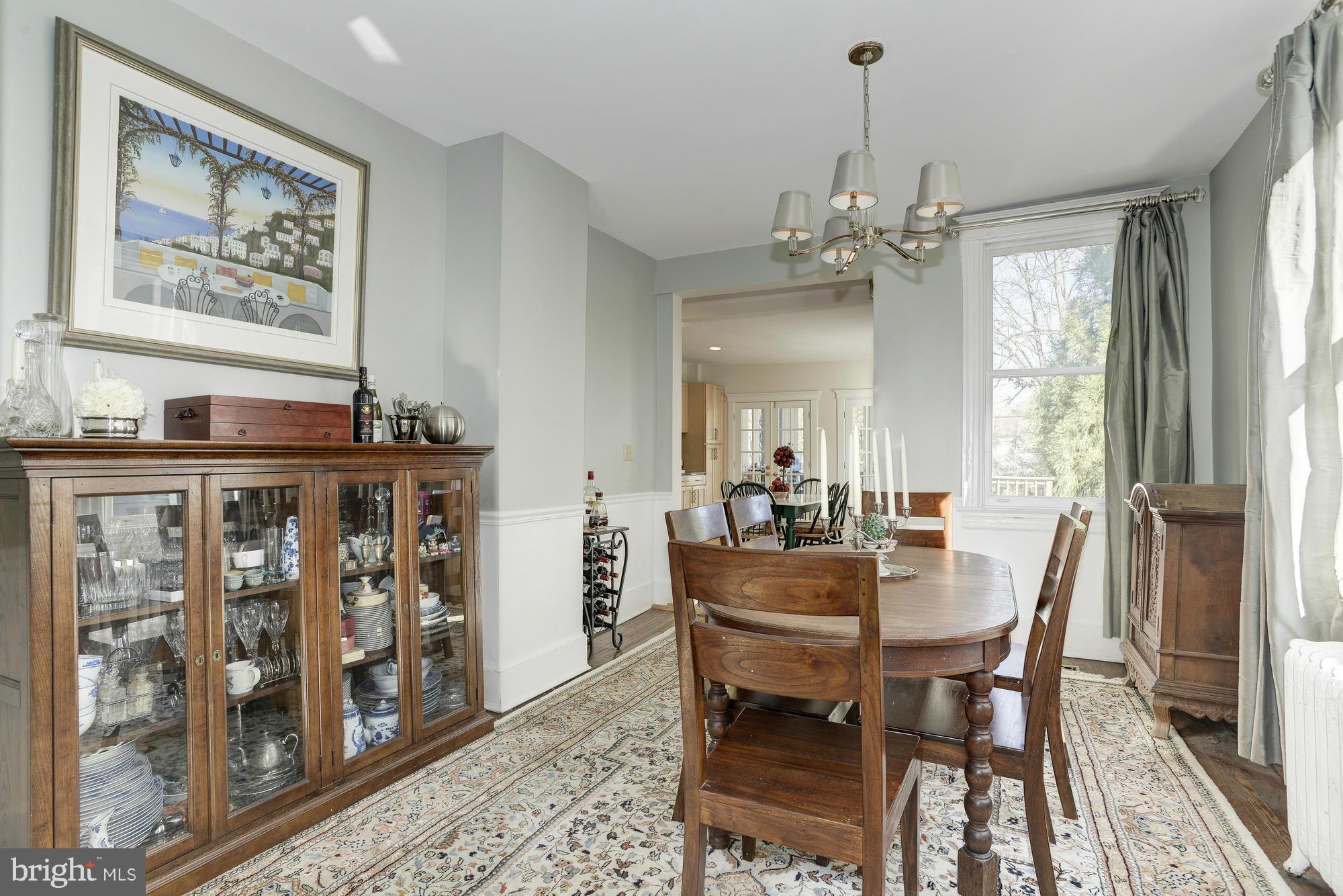 1419 Foxhall Road Northwest Washington, DC 20007 - Photo 5 of 19 a view of a dining room with furniture window and wooden floor