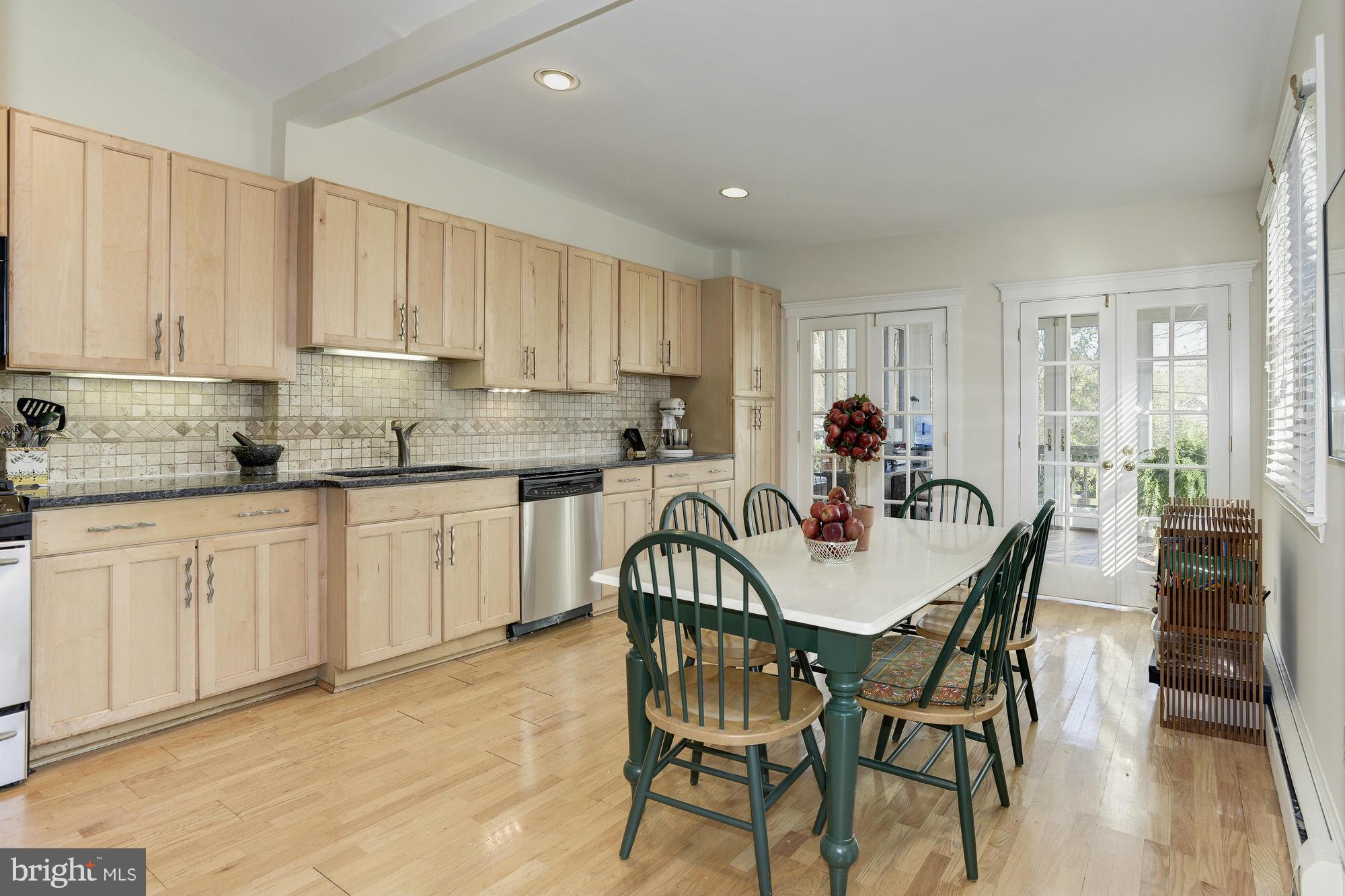 1419 Foxhall Road Northwest Washington, DC 20007 - Photo 6 of 19 a view of a dining room with furniture and wooden floor