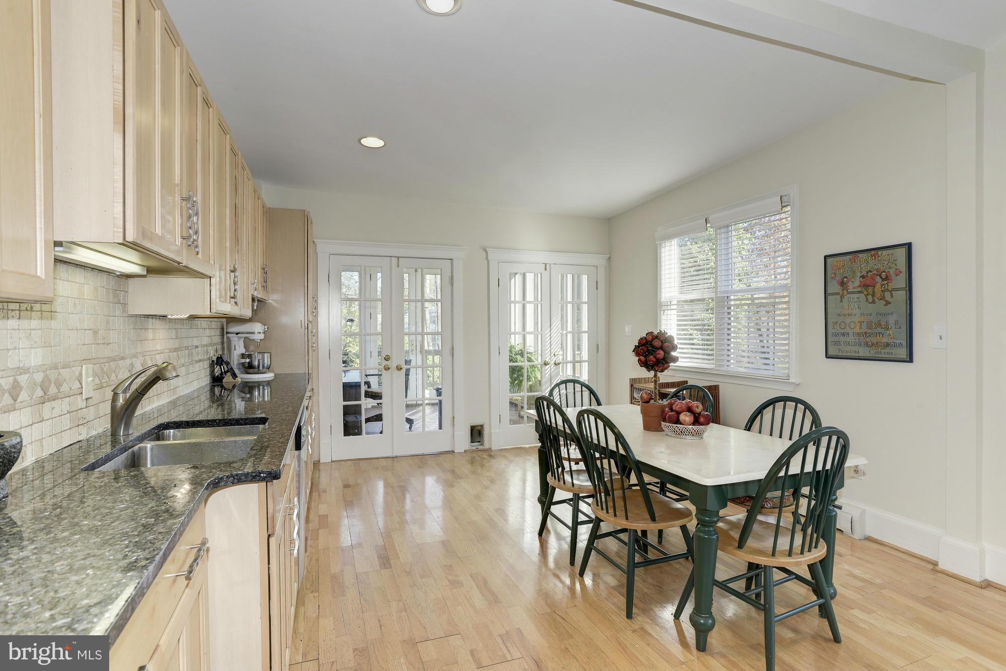 1419 Foxhall Road Northwest Washington, DC 20007 - Photo 7 of 19 a dining room with furniture and wooden floor