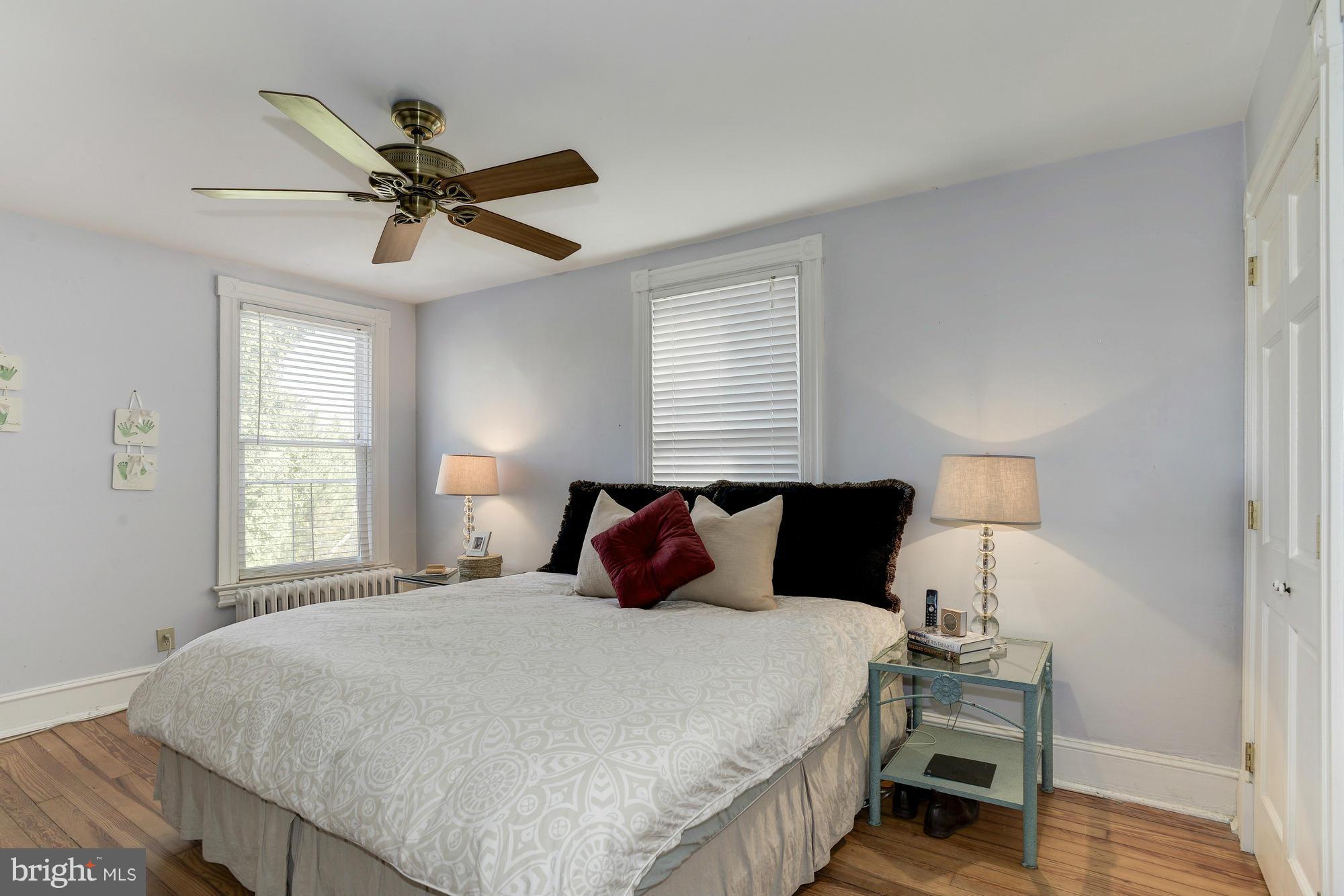 1419 Foxhall Road Northwest Washington, DC 20007 - Photo 10 of 19 a bedroom with a bed and window