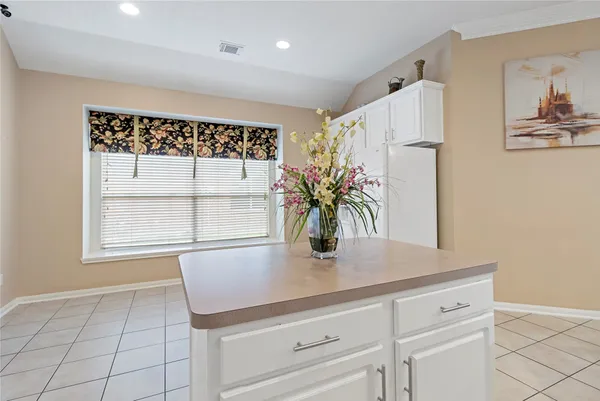 a close view of kitchen countertops with cabinets and wooden floor