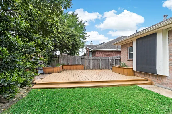a view of a house with pool and chairs