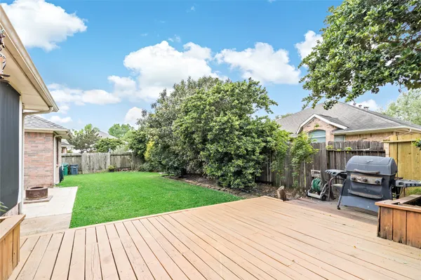 a view of a backyard with sitting area