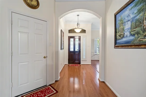 a view of gallery with wooden floor