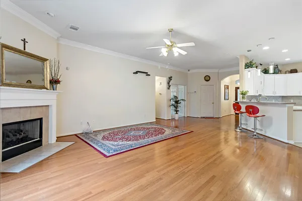 a living room with furniture fireplace and flat screen tv