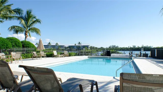 a view of swimming pool with outdoor seating