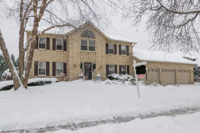 a view of a house with snow on the road
