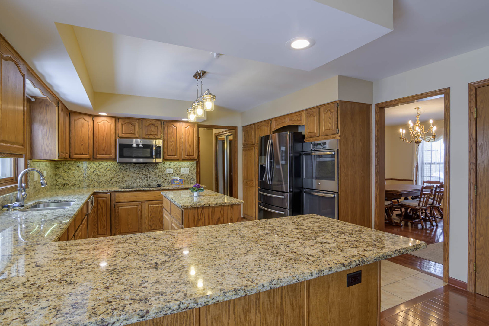 1995 Salem Road Elgin, IL 60123 - Photo 11 of 29 a kitchen with stainless steel appliances granite countertop a sink refrigerator and cabinets
