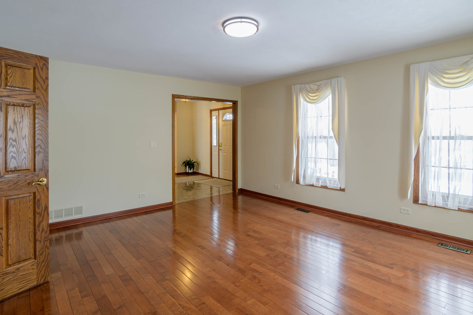 1995 Salem Road Elgin, IL 60123 - Photo 5 of 29 an empty room with wooden floor and windows