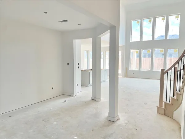 a large kitchen with kitchen island a sink stainless steel appliances and cabinets