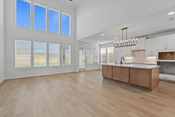 a view of a kitchen with a sink and cabinets
