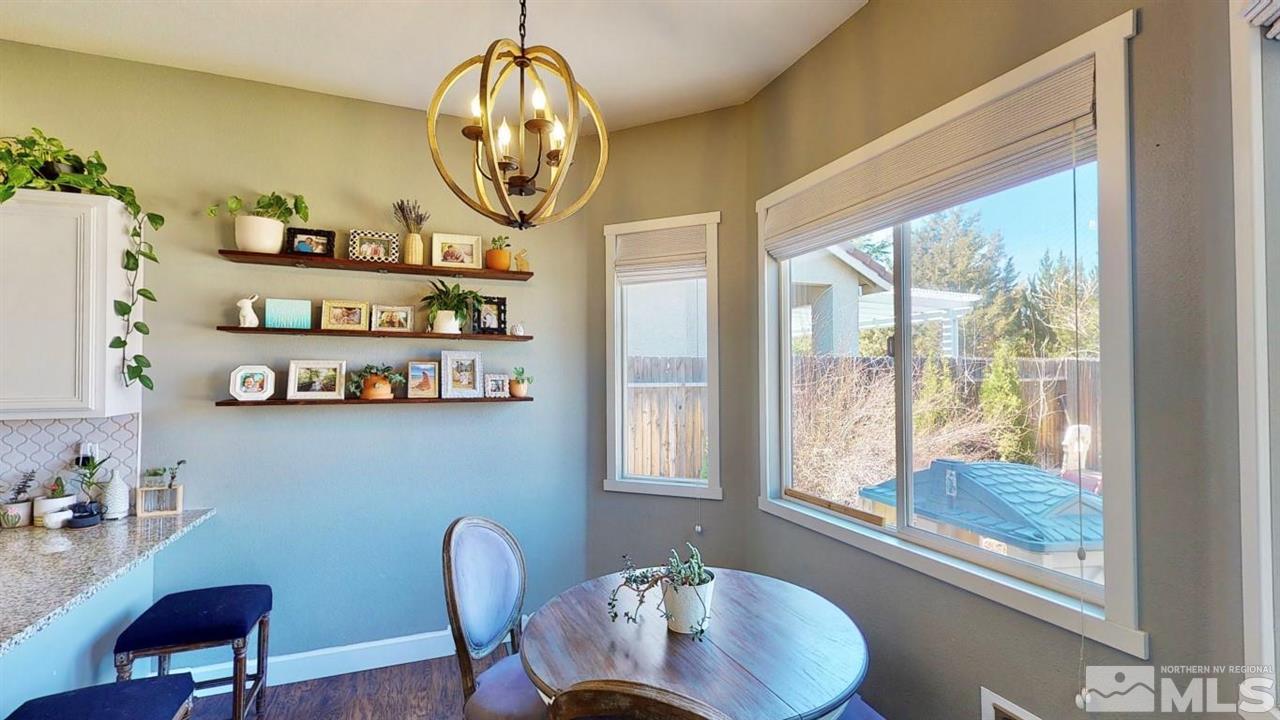 10621 Copper Moon Court Reno, NV 89521 - Photo 12 of 33 a view of a dining room with furniture and a window