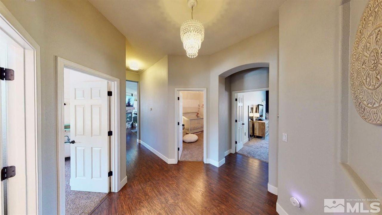 10621 Copper Moon Court Reno, NV 89521 - Photo 18 of 33 a view of a hallway with wooden floor and staircase