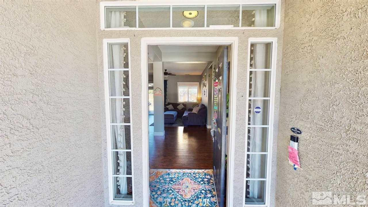 10621 Copper Moon Court Reno, NV 89521 - Photo 2 of 33 a view of a hallway with a dining room