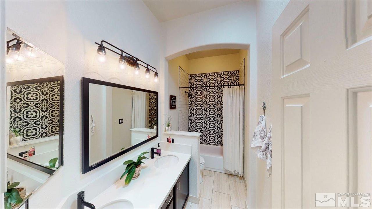 10621 Copper Moon Court Reno, NV 89521 - Photo 21 of 33 a hall way with wooden floor and staircase