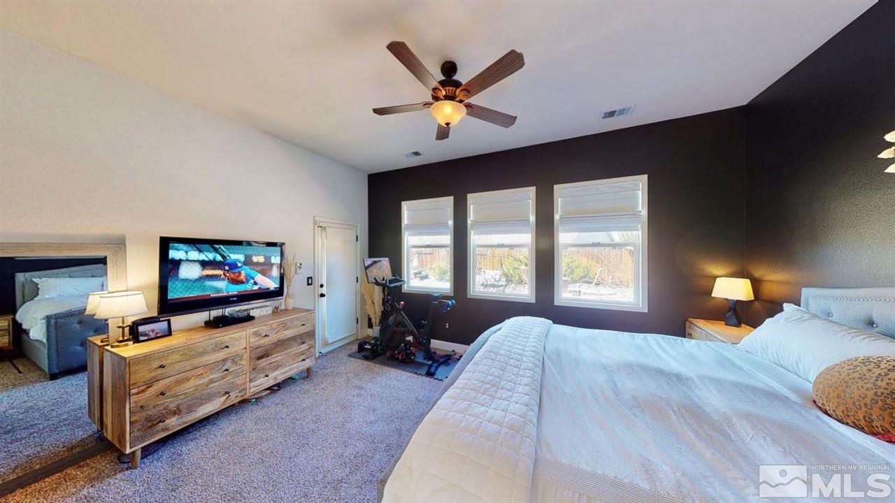 10621 Copper Moon Court Reno, NV 89521 - Photo 25 of 33 a living room with furniture flat screen tv and a large window