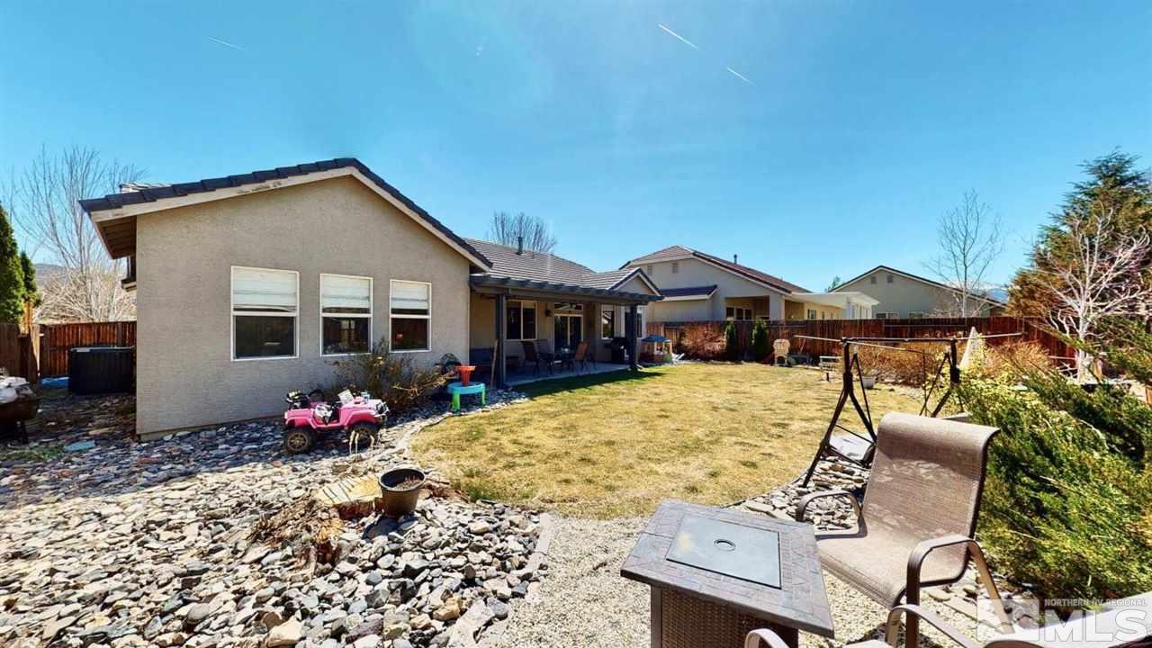 10621 Copper Moon Court Reno, NV 89521 - Photo 28 of 33 a front view of a house with a yard