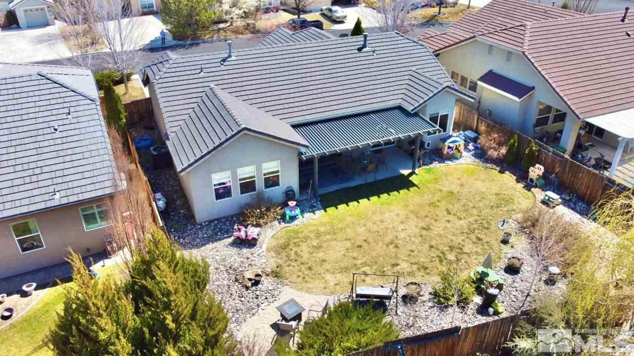 10621 Copper Moon Court Reno, NV 89521 - Photo 29 of 33 a front view of a house with a yard