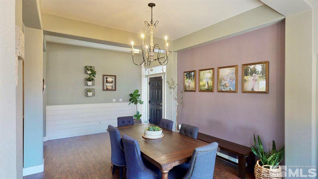 10621 Copper Moon Court Reno, NV 89521 - Photo 6 of 33 a view of a dining room with furniture and a chandelier fan