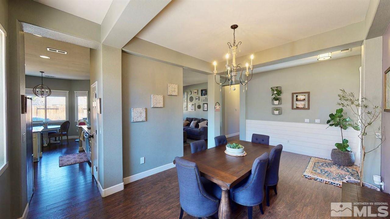 10621 Copper Moon Court Reno, NV 89521 - Photo 7 of 33 a view of a dining room with furniture and wooden floor