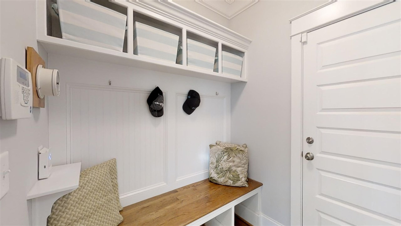 3128 Constance Circle Raleigh, NC 27603 - Photo 12 of 25 Mudroom with organized shelving and bench.