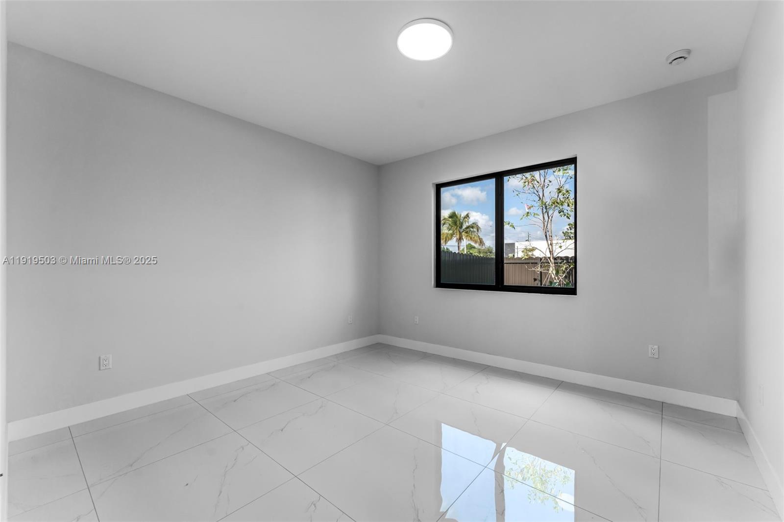 12393 Southwest 220th Street Miami, FL 33170 - Photo 13 of 22 an empty room with windows