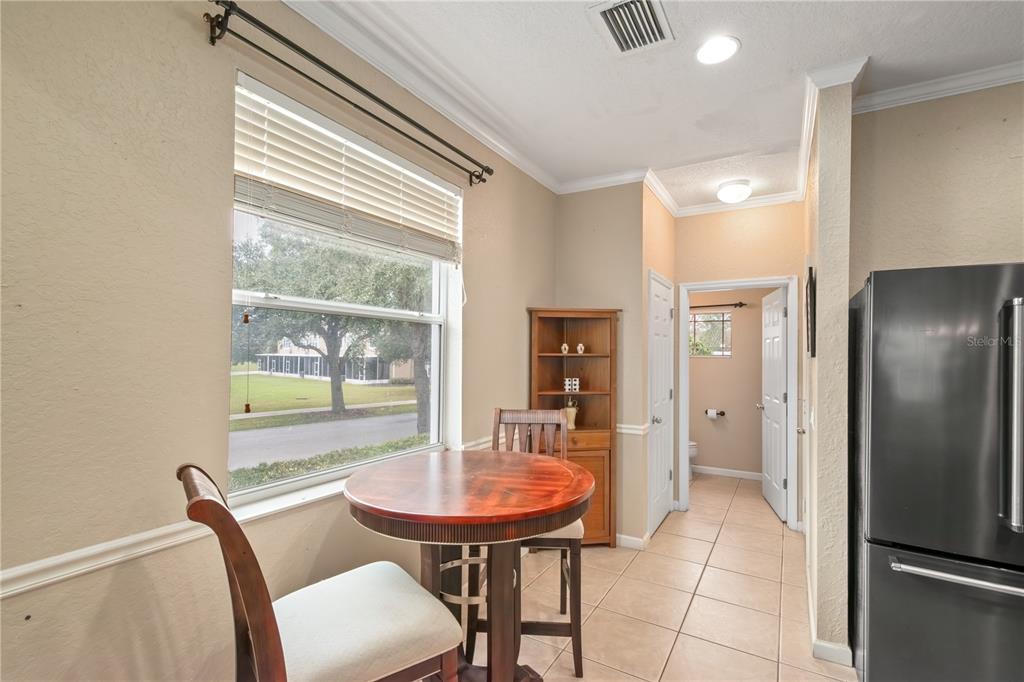 4122 Southwest 54th Circle Ocala, FL 34474 - Photo 13 of 47 a view of a dining room with furniture and a window