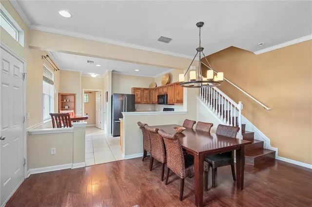 a dining room with furniture and entryway