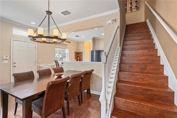 a view of a dining room with furniture and wooden floor