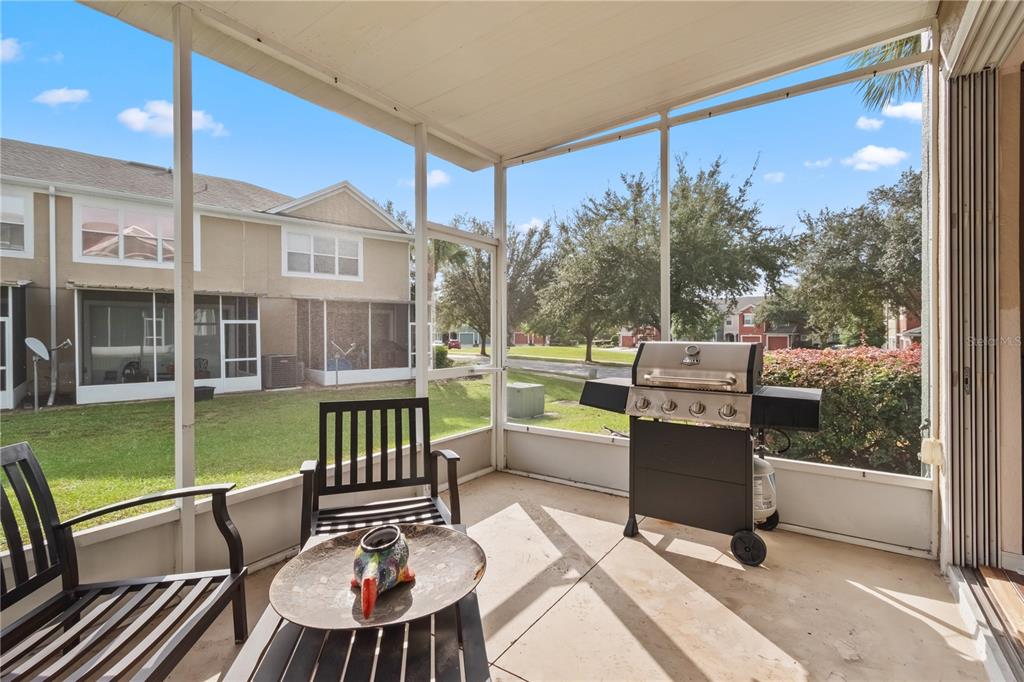 4122 Southwest 54th Circle Ocala, FL 34474 - Photo 23 of 47 a view of a patio with a table chairs and a backyard