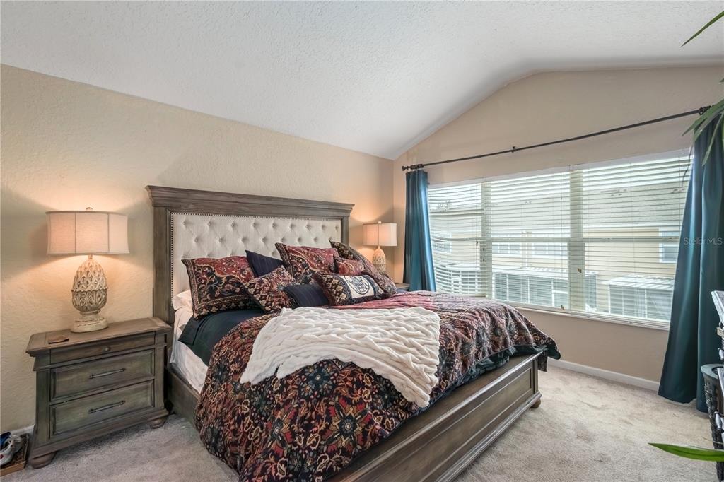 4122 Southwest 54th Circle Ocala, FL 34474 - Photo 24 of 47 a bedroom with a large bed and window