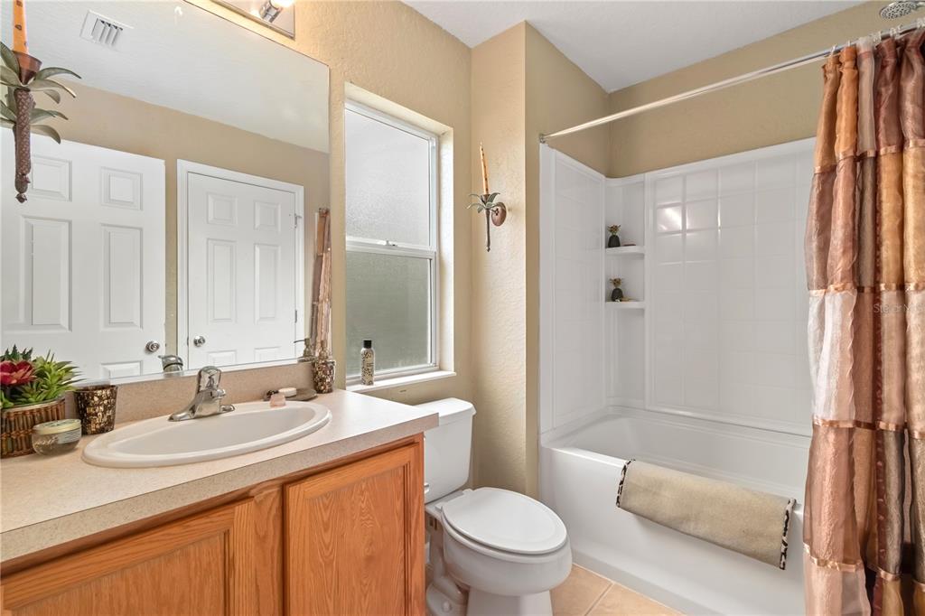 4122 Southwest 54th Circle Ocala, FL 34474 - Photo 34 of 47 a bathroom with a sink toilet and shower